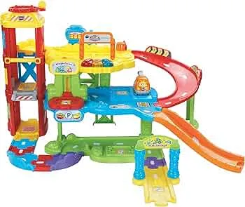 VTech Baby Flitzer - Parkgarage – Interaktives Spielzeug mit Abschleppwagen, Aufzug, Rutsche, Tankstelle u. v. m. – Für Kinder von 1-5 Jahren: Amazon.de: Baby